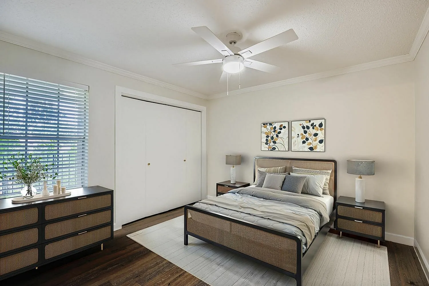 Primary bedroom, wood-style plank flooring, ceiling fan with lighting, wood frame bed