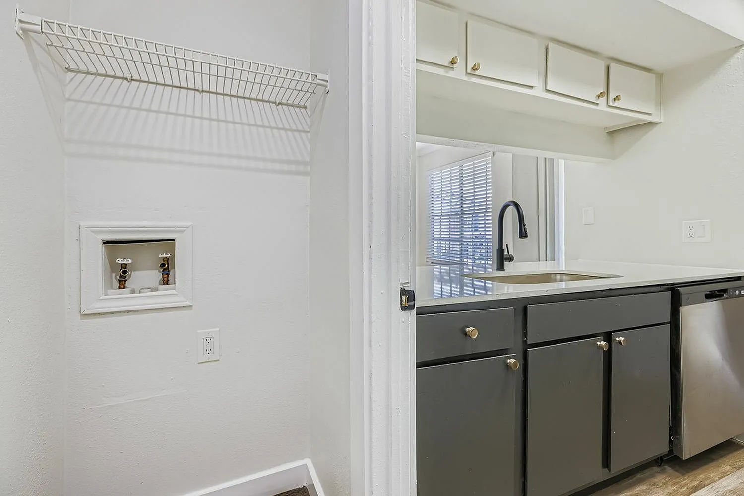 Kitchen, dark gray shaker cabinetry, stainless appliances, black faucet, upper cabinets, wood-style plank flooring