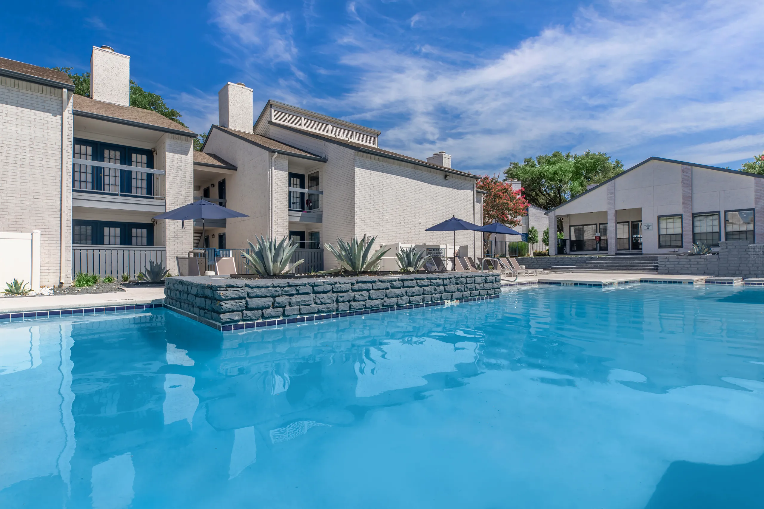 Community swimming pool surrounded by apartment buildings