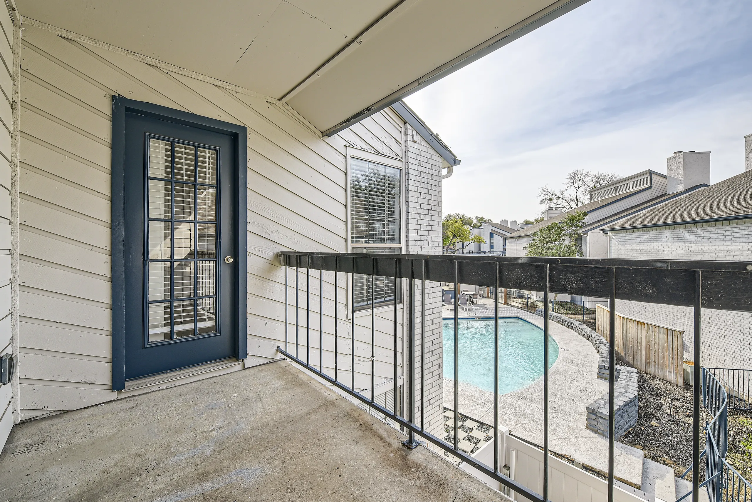 Private balcony overlooking the community swimming pool