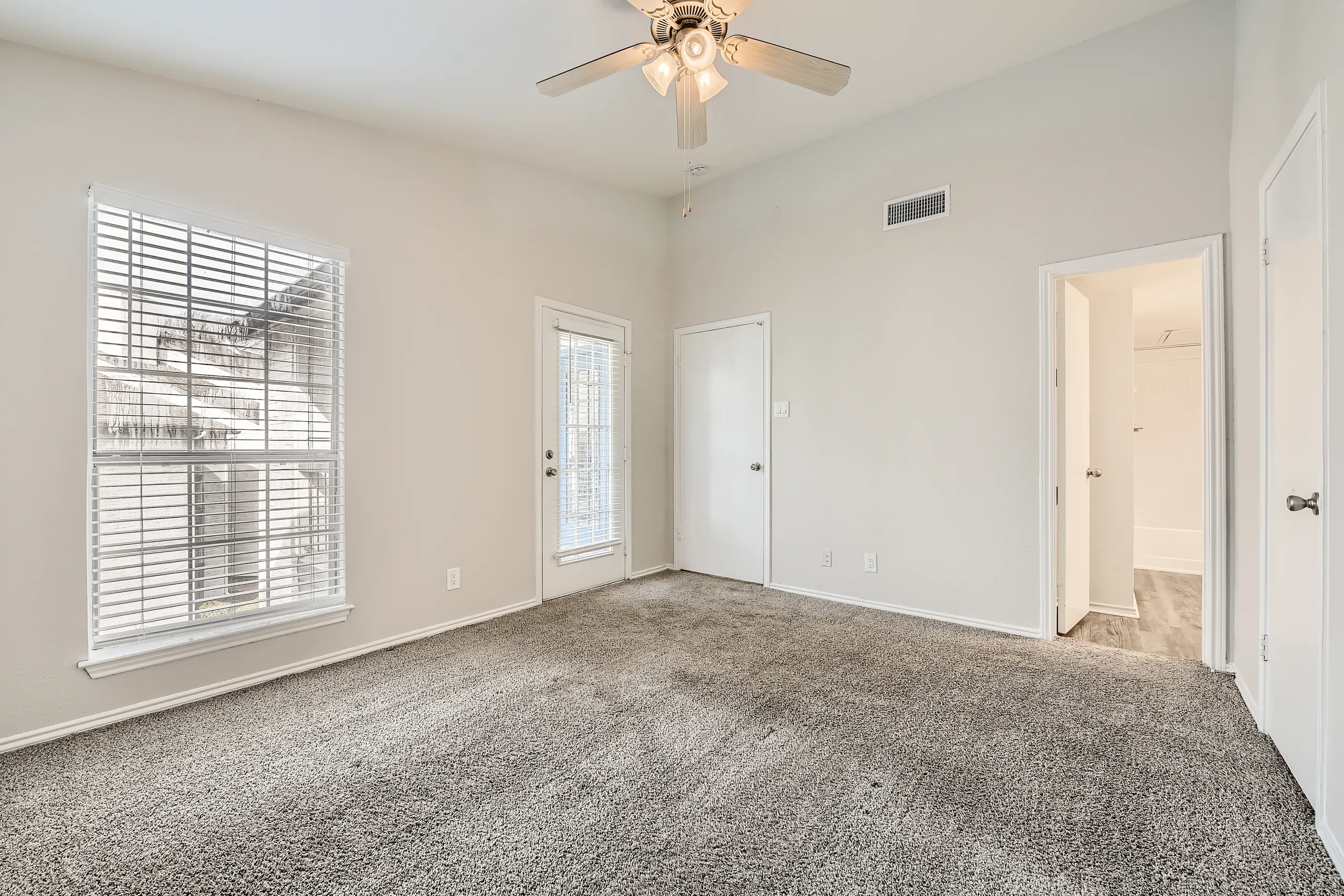 Primary bedroom with walk-in closet and en-suite bathroom access