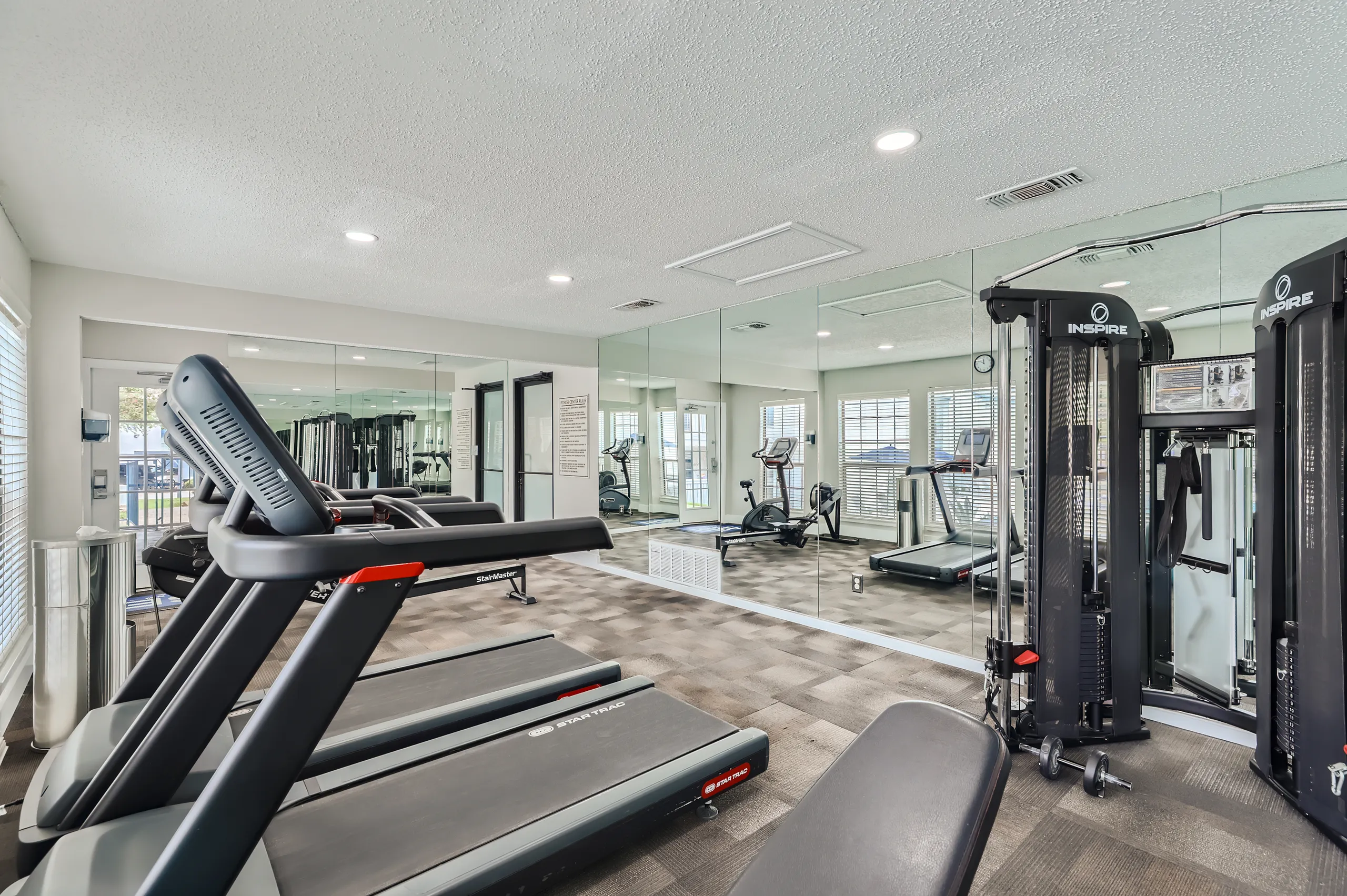 Fitness center with treadmills and strength training equipment