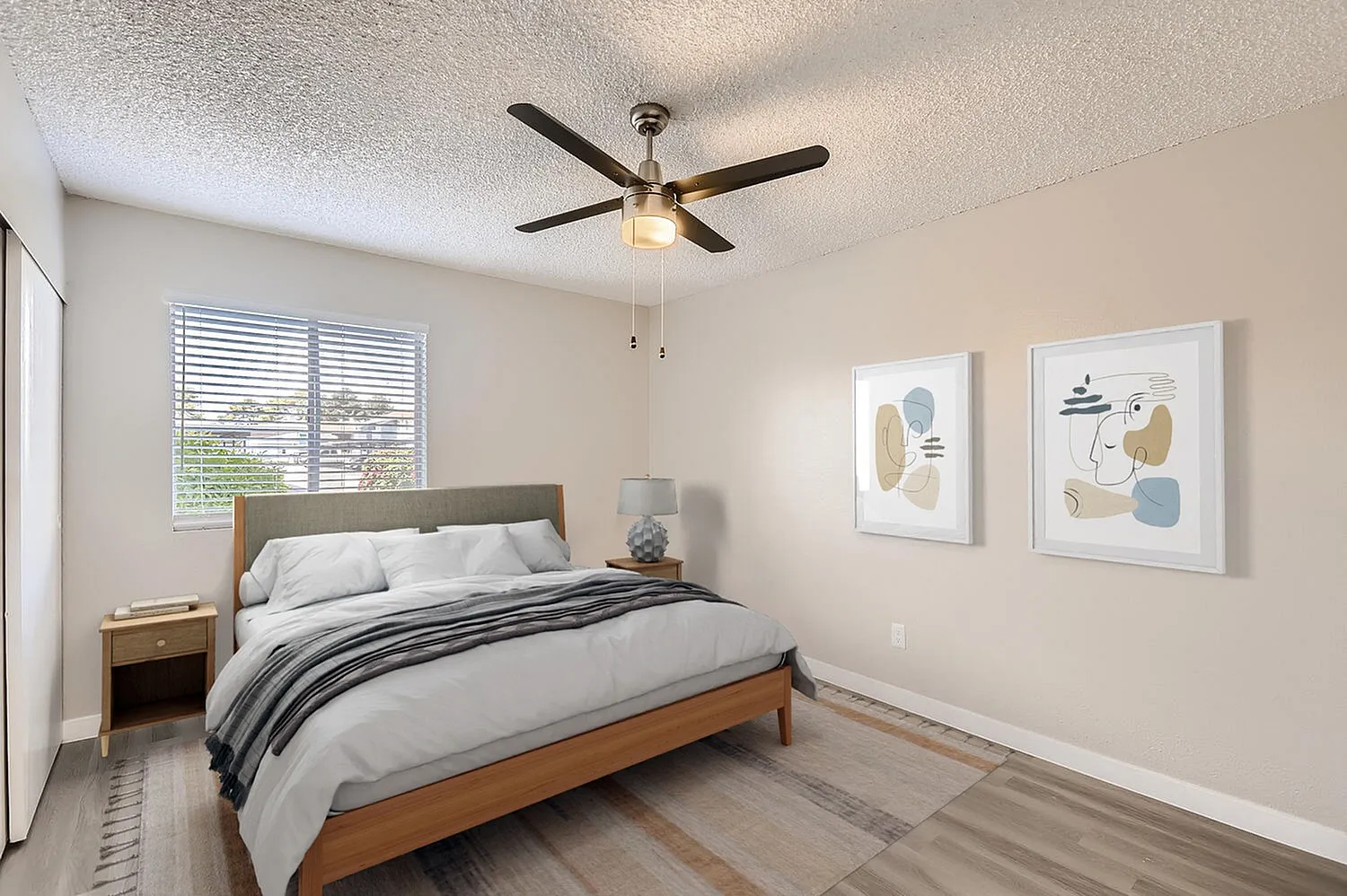 Primary bedroom, wood-style plank flooring, wood frame bed, ceiling fan, window with shutters