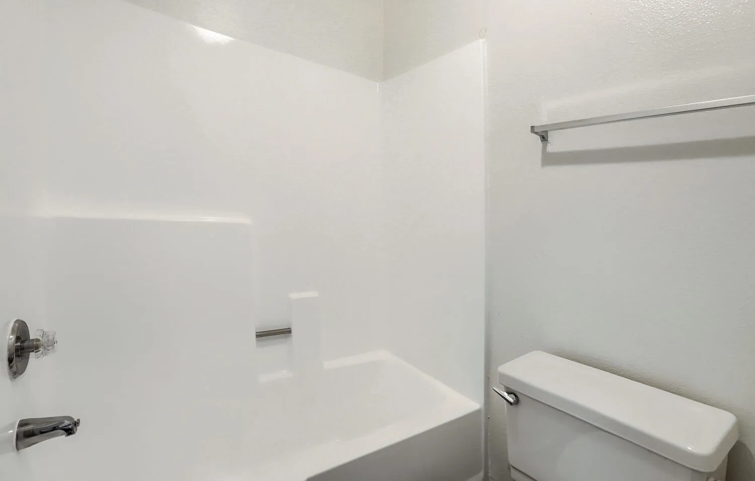 Primary bathroom with tub and shower combo