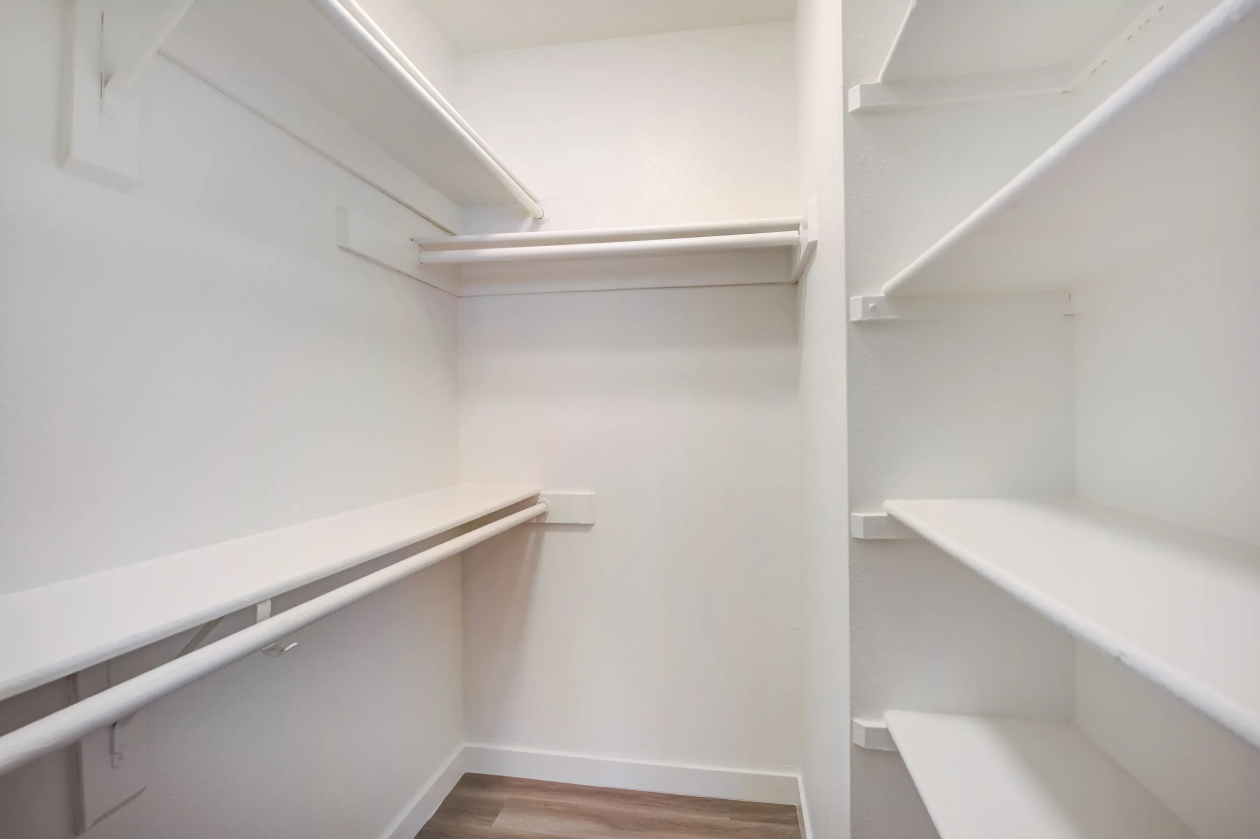 Bedroom walk-in closet with built-in shelving