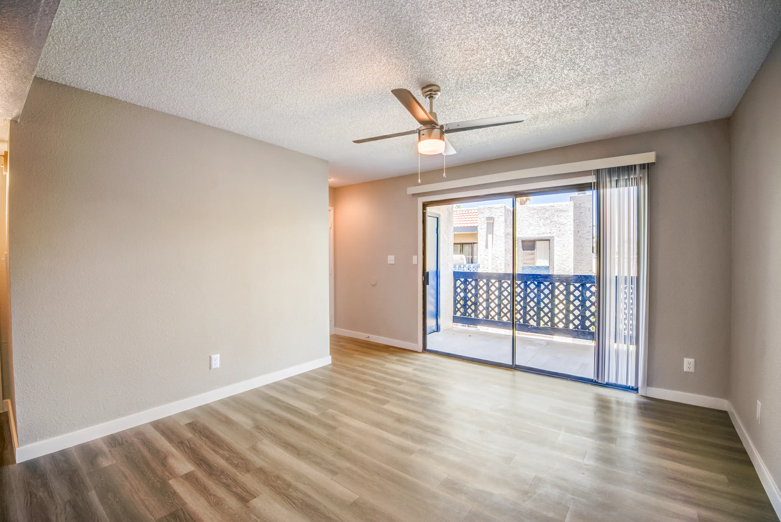 B1 Platinum floor plan living room with ceiling fan and private balcony