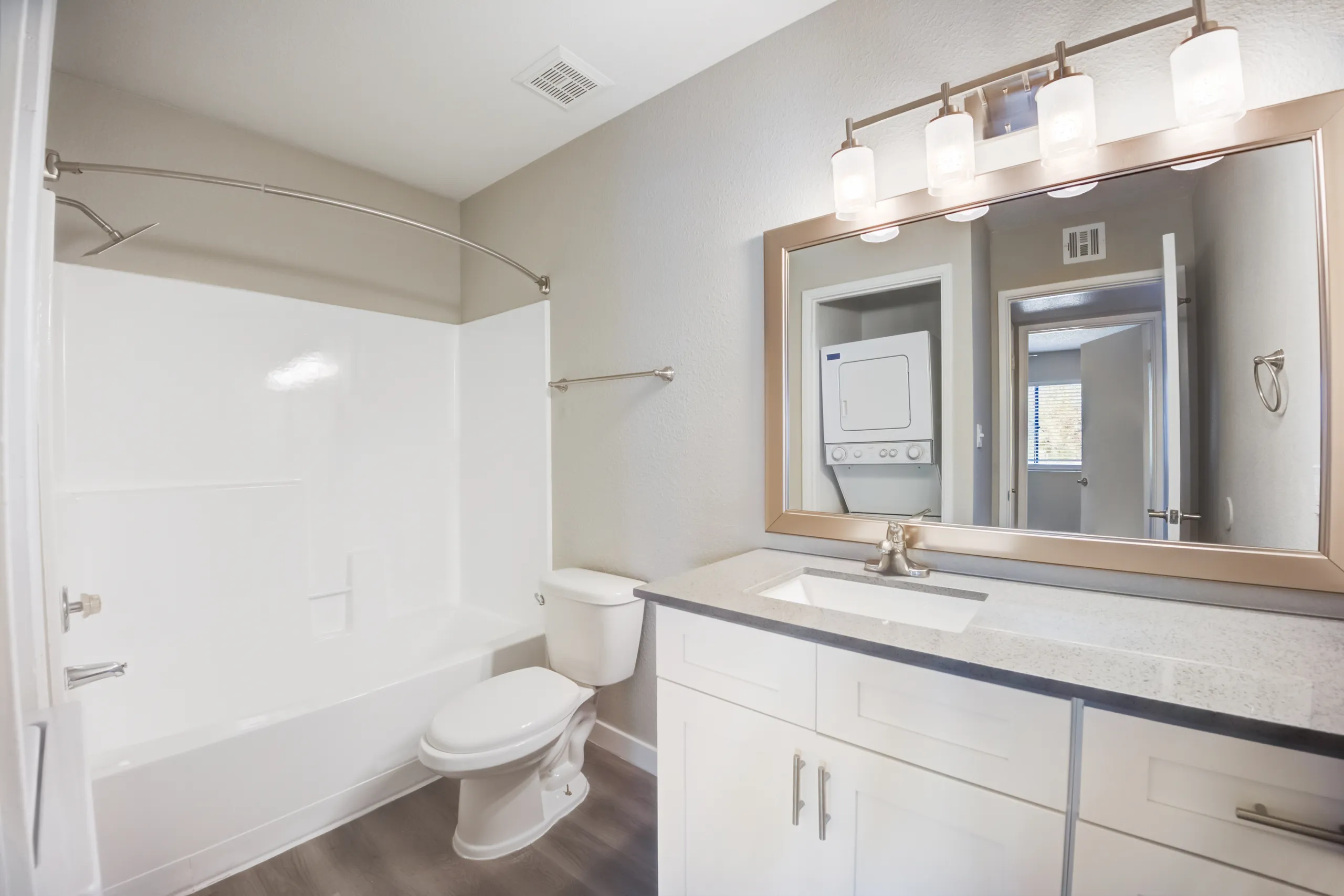 Bathroom with in-unit stacked washer and dryer