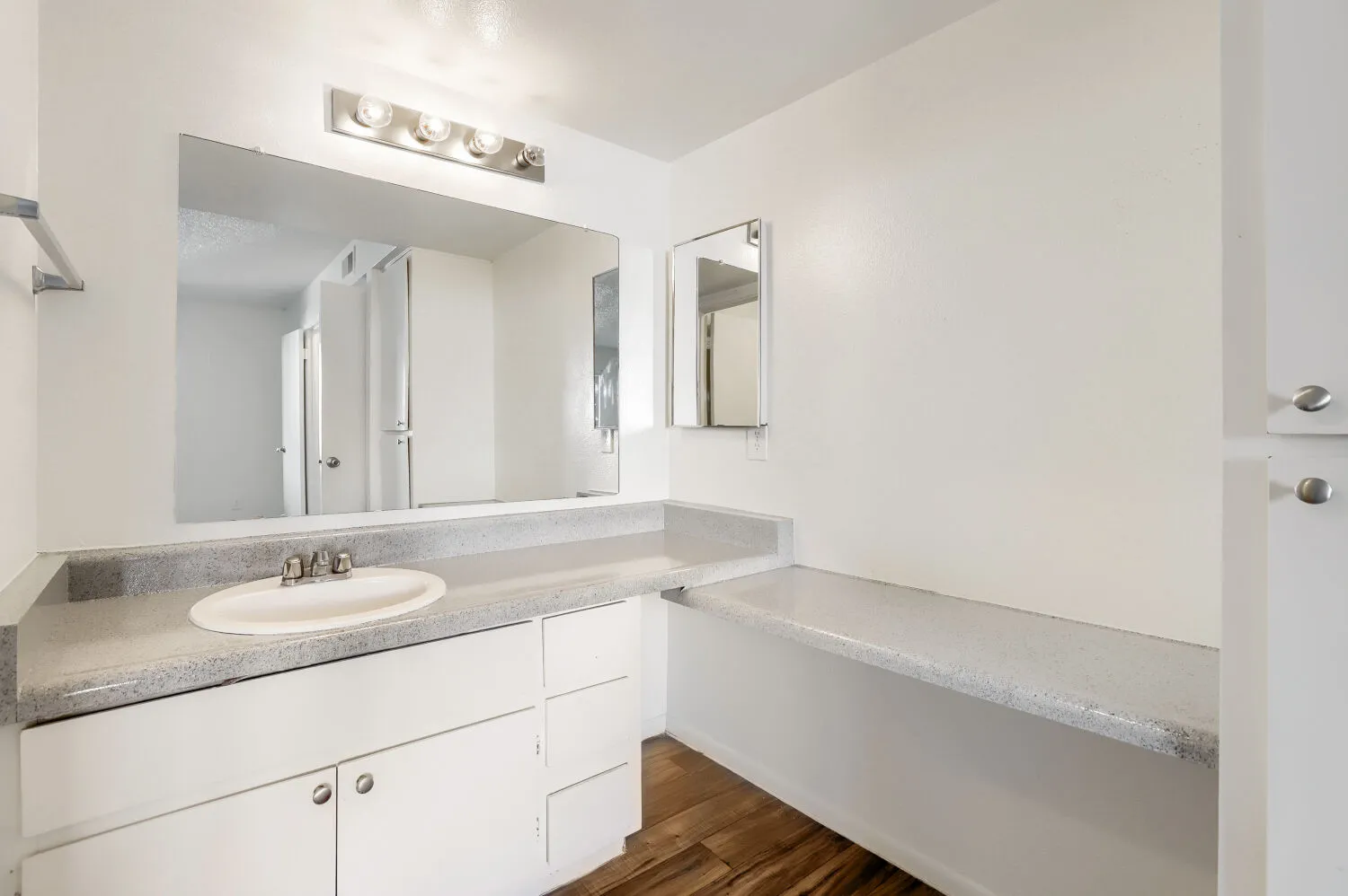 Primary bathroom vanity with extended counter space