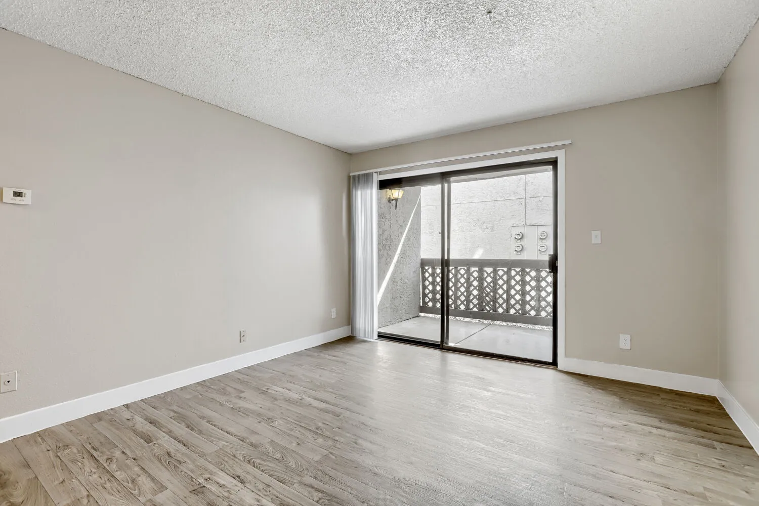 A1 Bronze floor plan living room with sliding glass door and private balcony