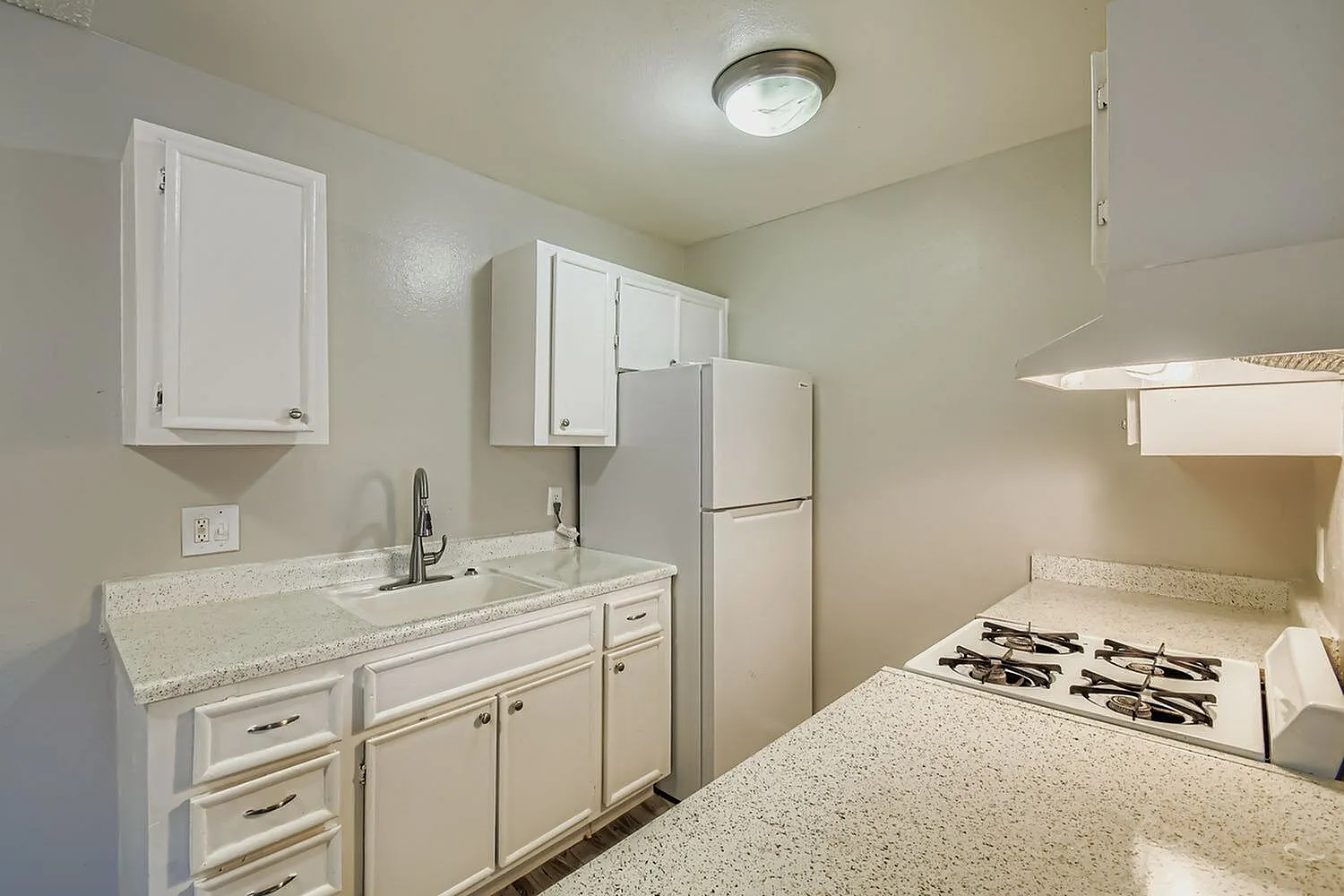 Kitchen, white shaker cabinetry, quartz countertops, stainless appliances