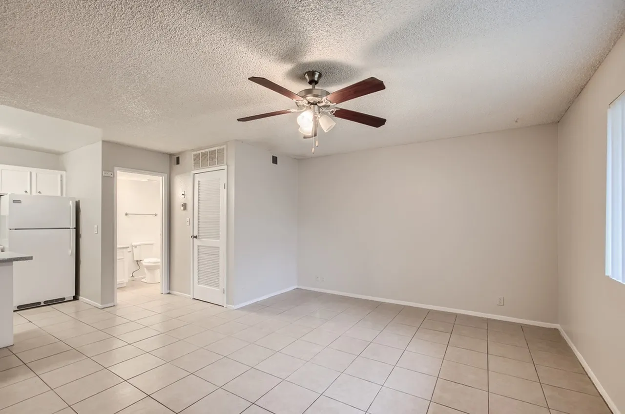 Kitchen and dining area, ceramic tile flooring, ceiling fan with light fixture, white appliances