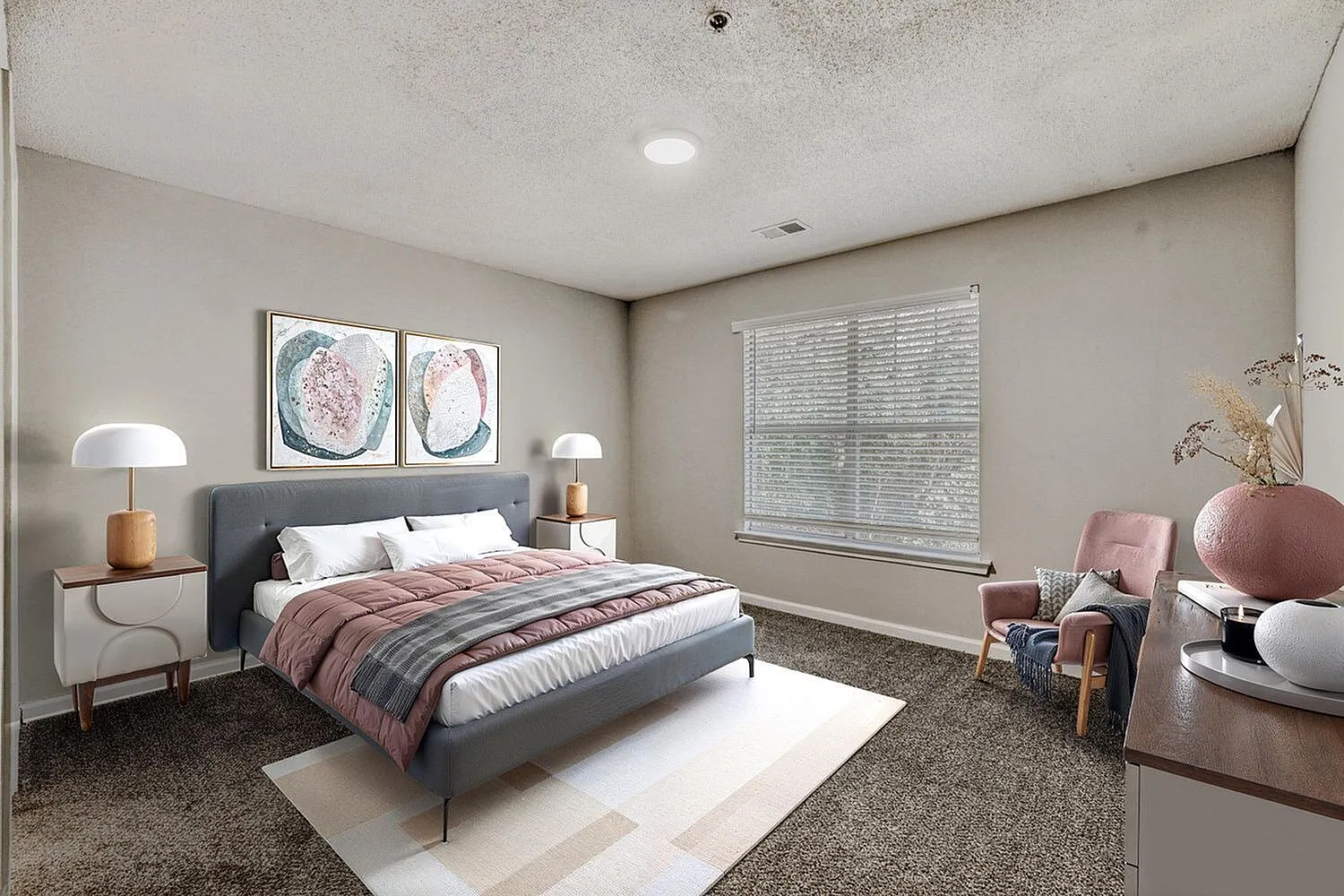 Primary bedroom, gray upholstered bed, wood-style side tables, recessed lighting, large window with shutters, area rug