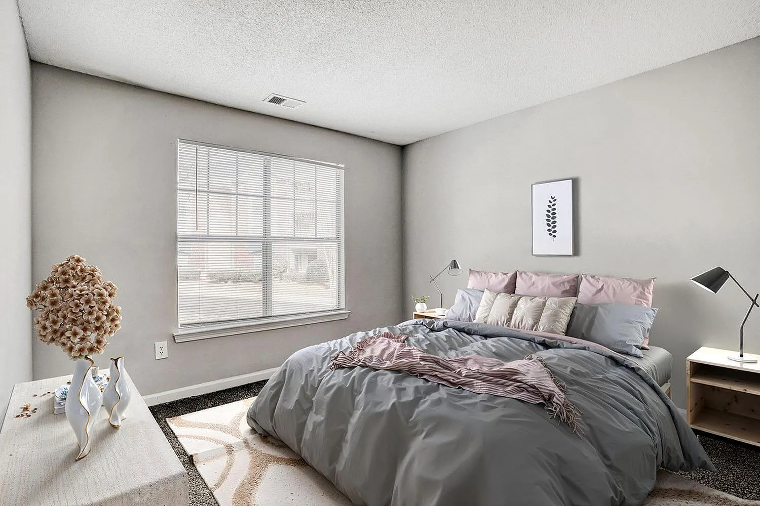 Bedroom, gray bedding, pink accent pillows, wood nightstands, large window