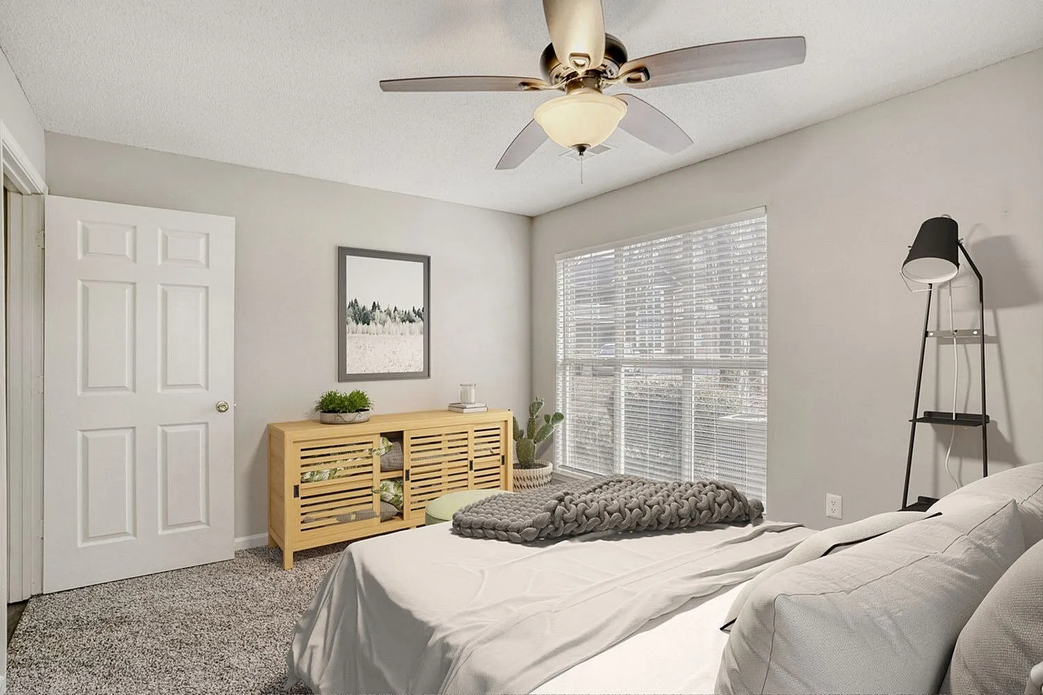 Primary bedroom, wood-style plank flooring, carpet area rug, wooden dresser, ceiling fan with light