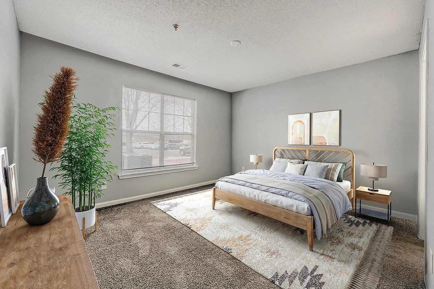 Primary bedroom, wood-style plank flooring, gray walls, wood bed frame, area rug