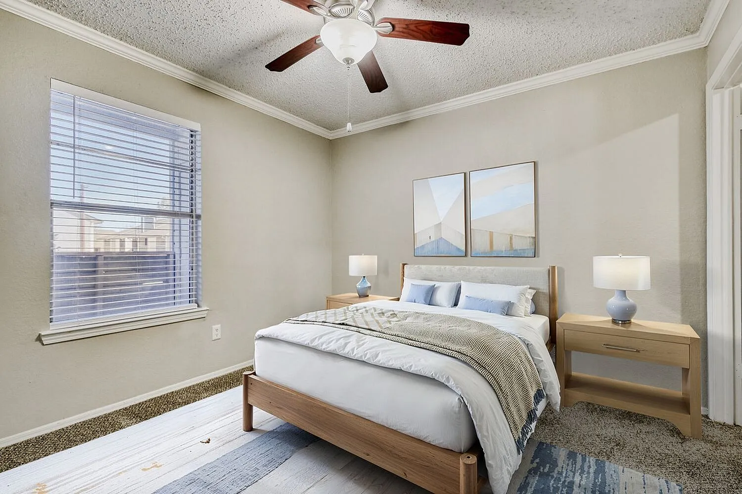 Primary bedroom, wood-style plank flooring, wood bed frame, ceiling fan