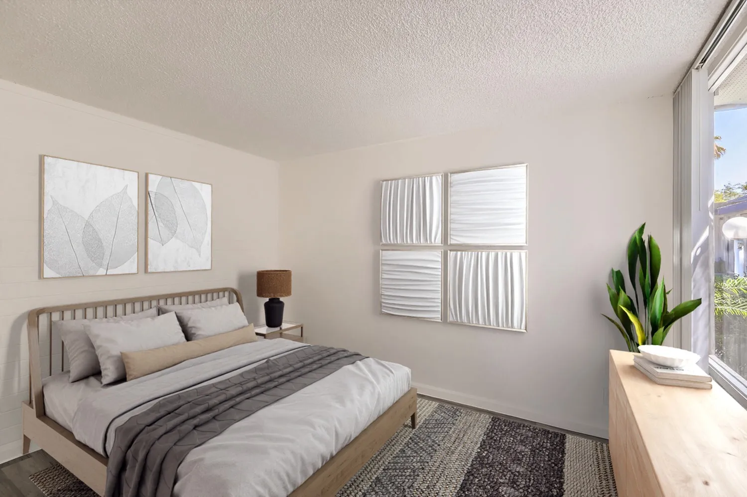 Primary bedroom, wood-style plank flooring, platform bed frame, wall art