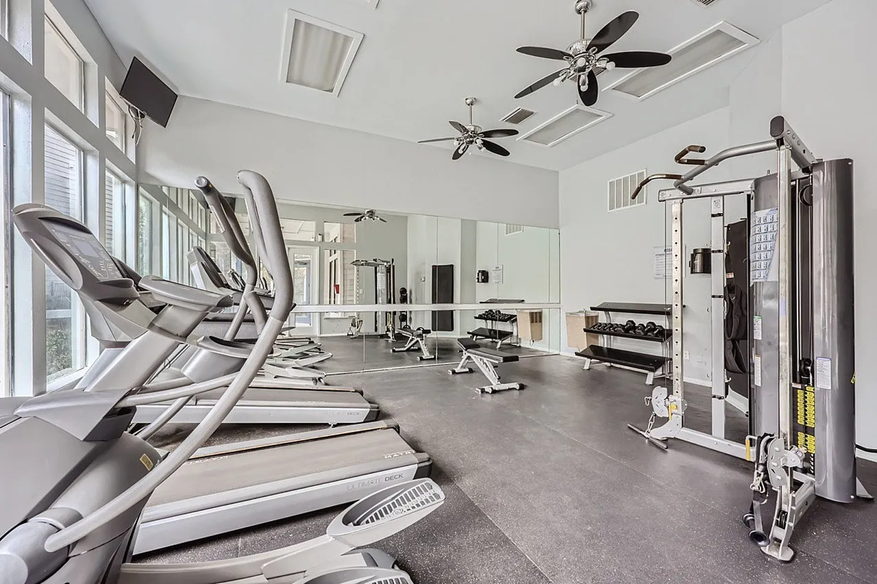Fitness center, treadmills, elliptical machines, ceiling fans, mirrored walls