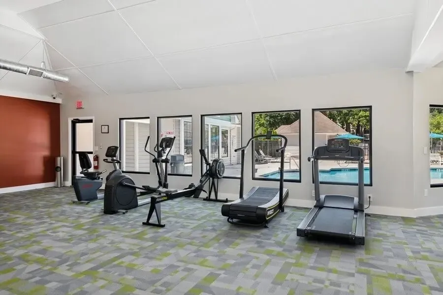 Fitness center, treadmills, elliptical machines, pool views