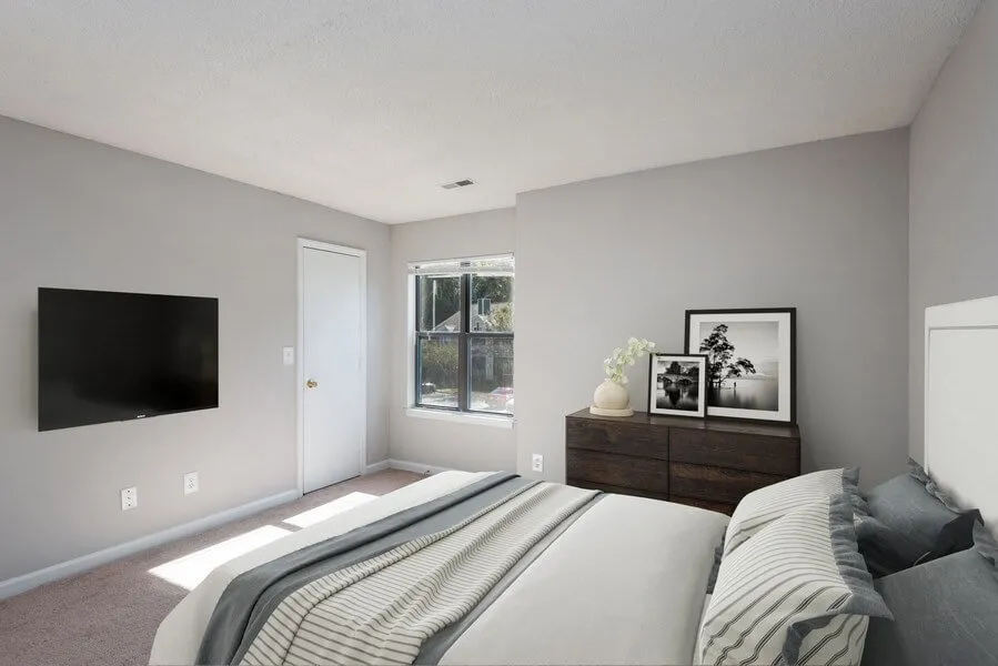 Primary bedroom, large window, wall-to-wall carpet