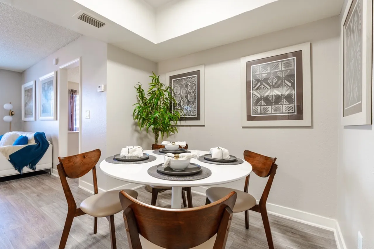 Dining area with recessed ceiling and neutral walls
