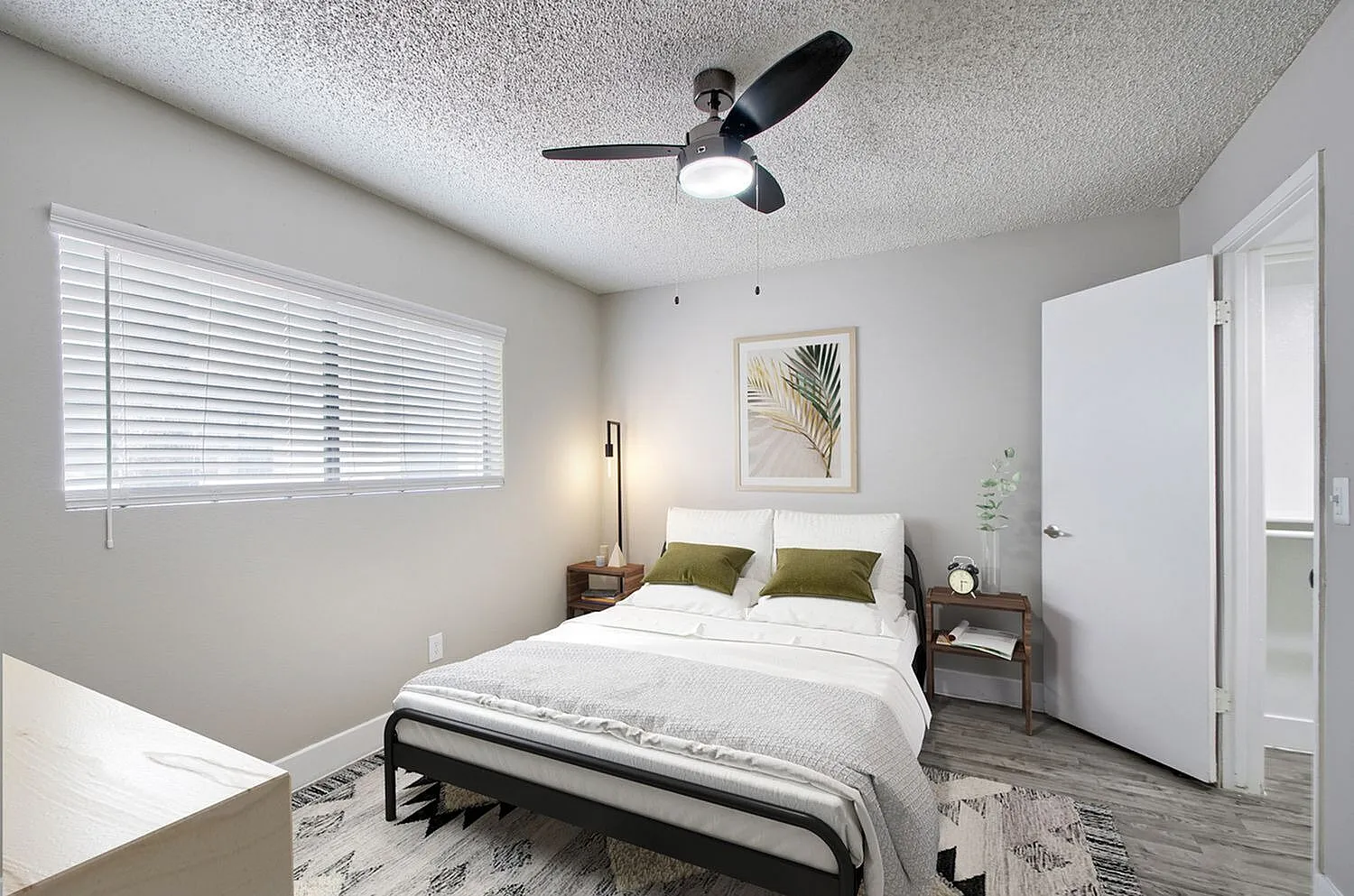 Bedroom with window blinds and ceiling fan