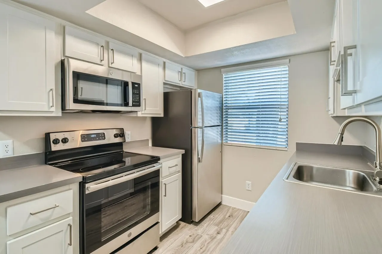 Stainless steel range, microwave, and refrigerator
