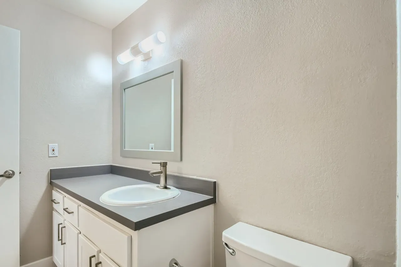 Single sink vanity with overhead light bar