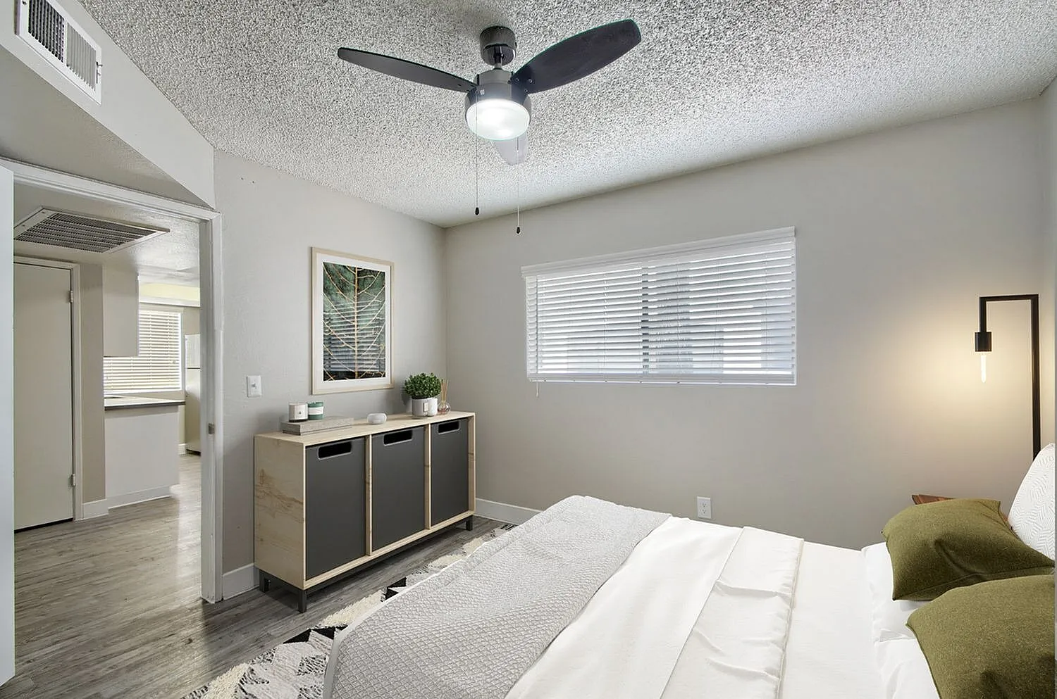 Bedroom with neutral walls and doorway access
