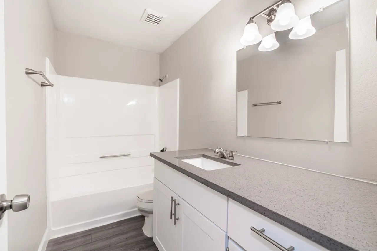 White shaker vanity and tub-shower