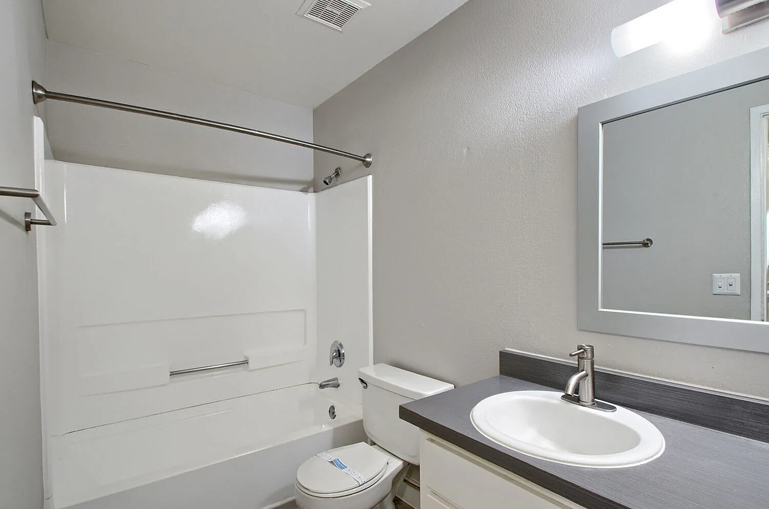 Tub-shower combo and single sink vanity