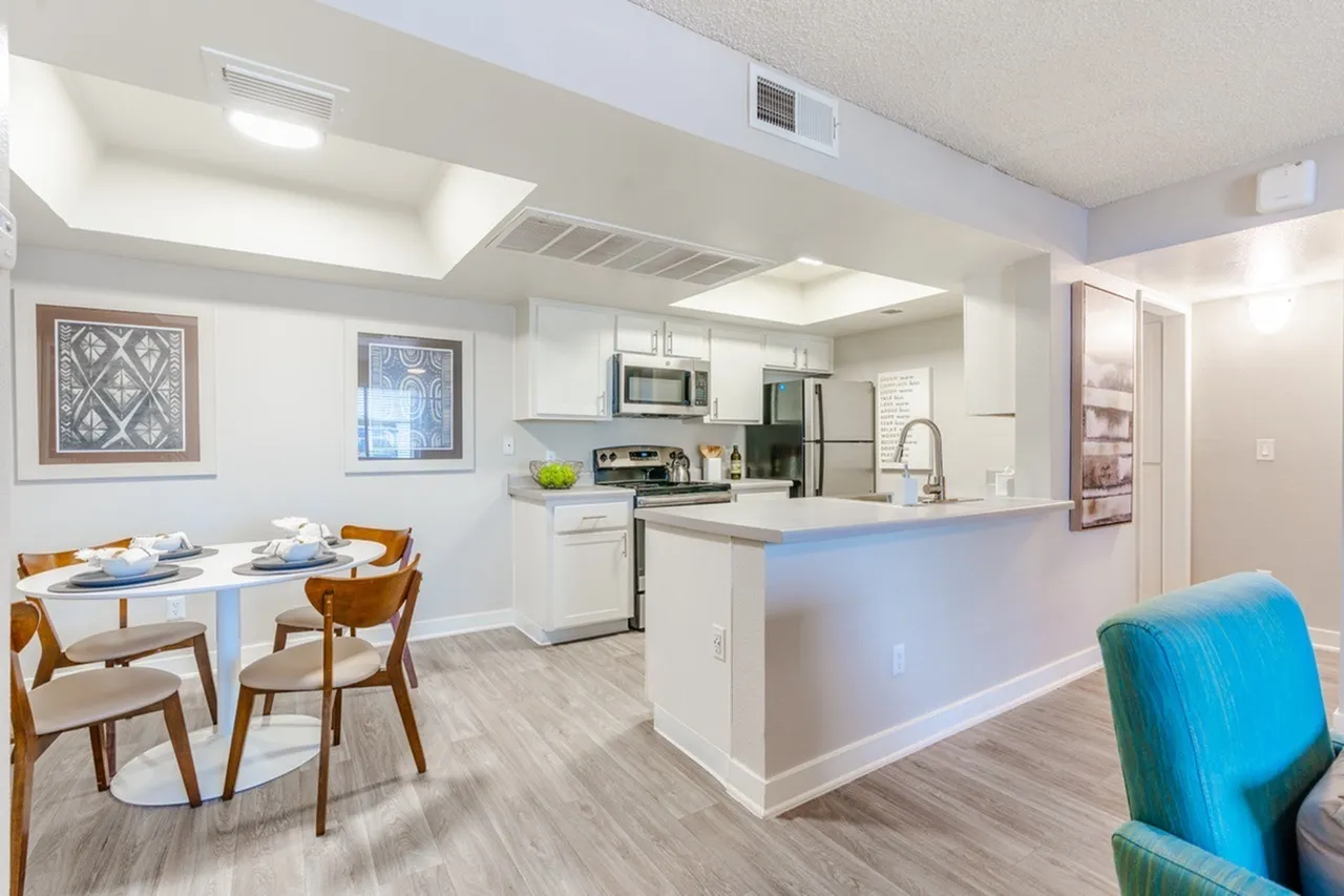 Open kitchen with island and adjacent dining space