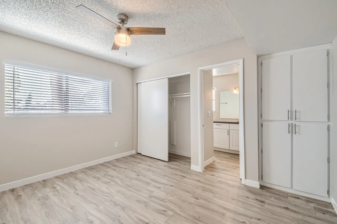 Bedroom with sliding closet and bathroom access