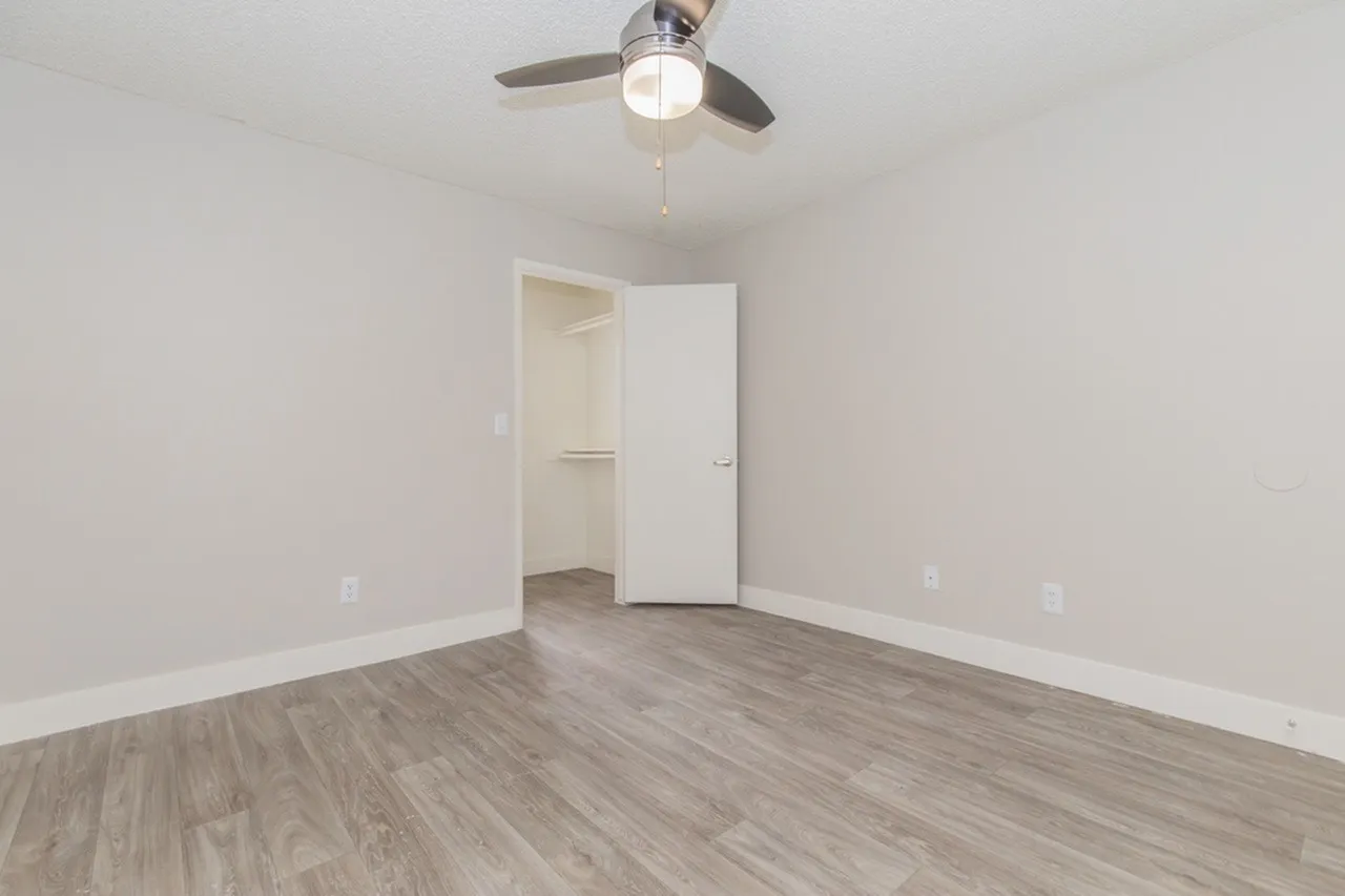 Bedroom with open door to walk-in closet