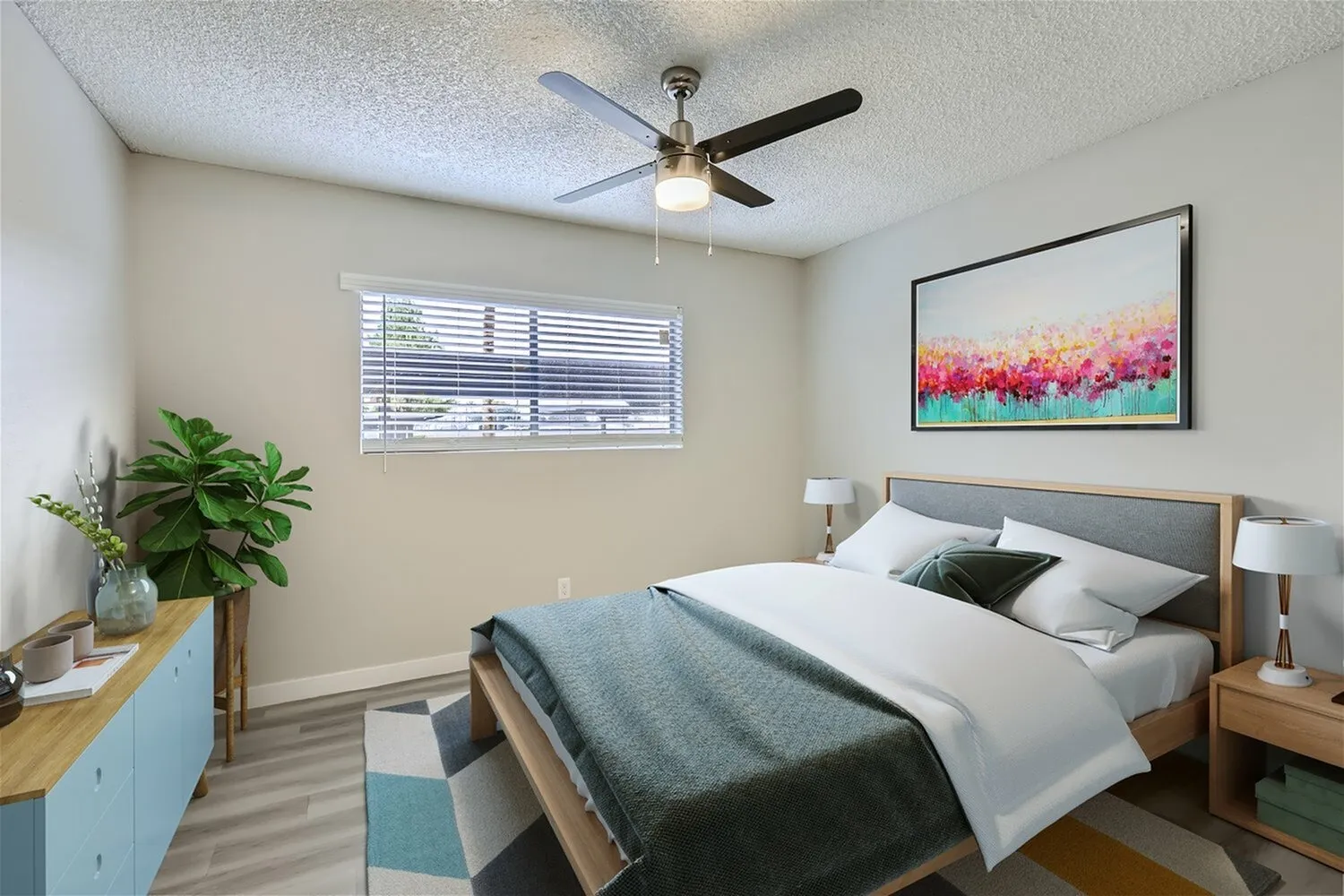 Bedroom with ceiling fan and window blinds