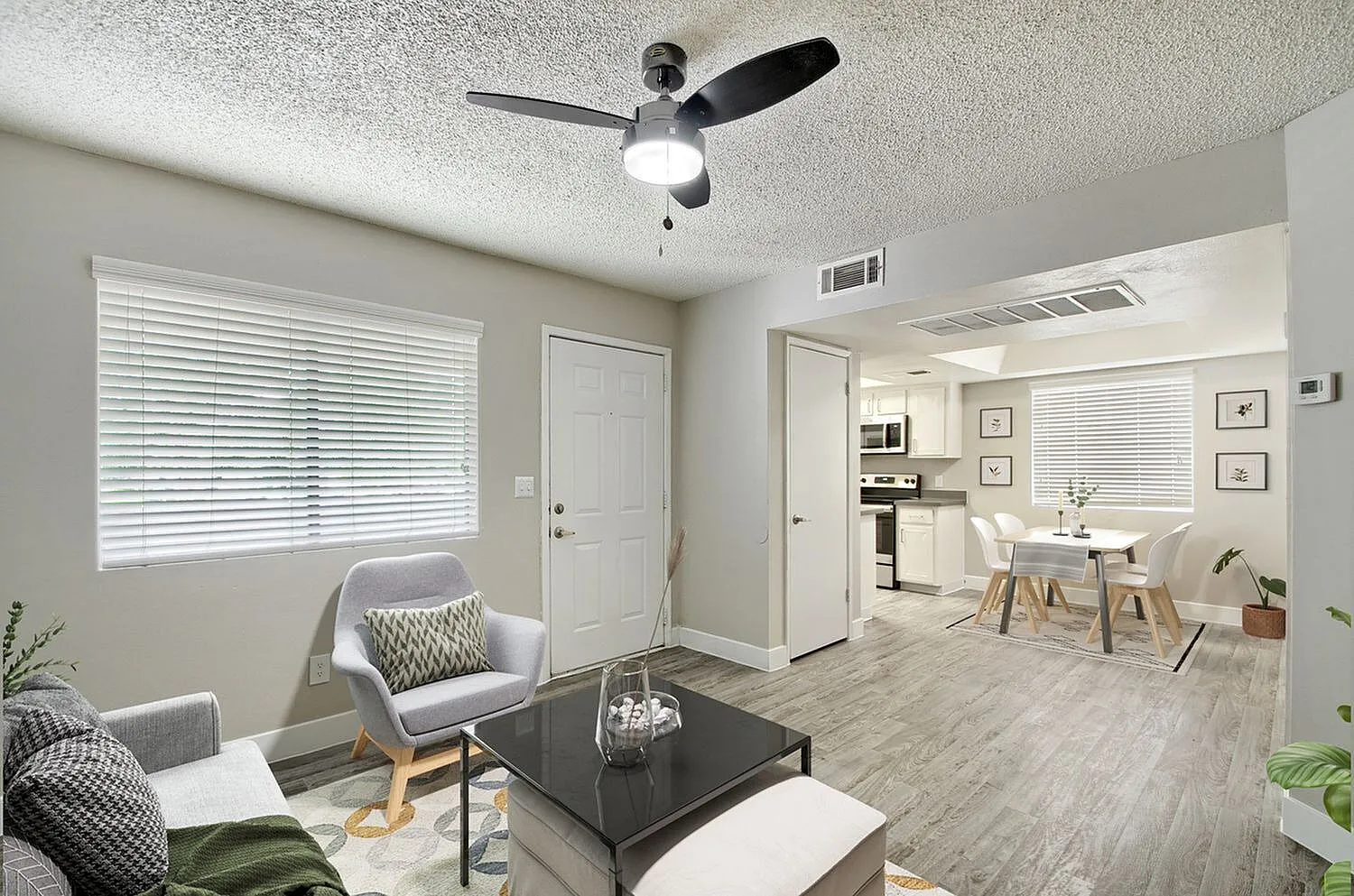 A3 Gold living area with ceiling fan and view into kitchen and dining