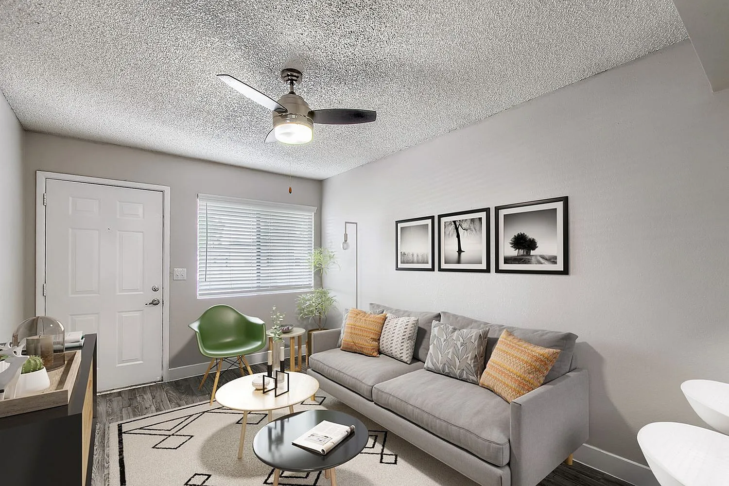 Living area with window blinds and neutral walls
