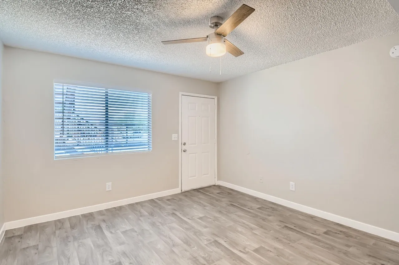 Living room with window and front entry
