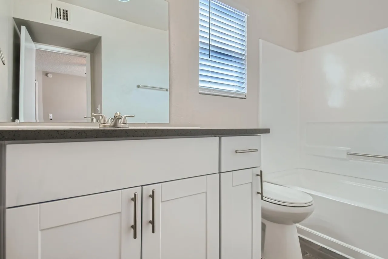 White shaker vanity and tub-shower