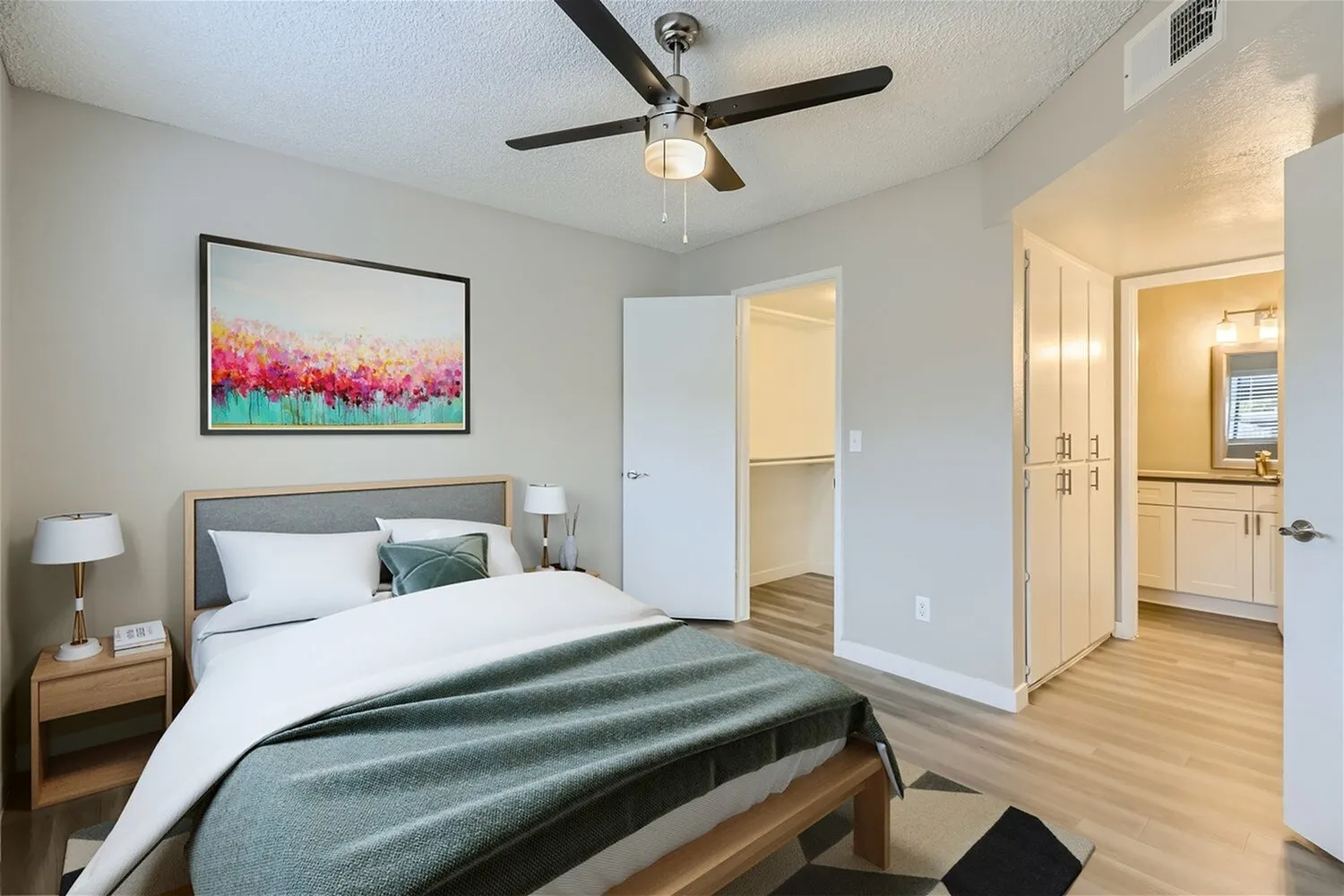 Bedroom with walk-in closet and linen cabinet