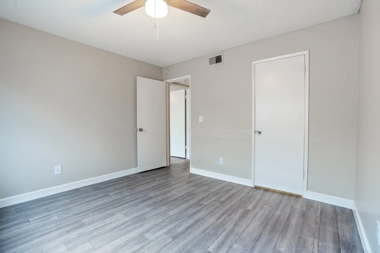 Bedroom with closet and hallway doors