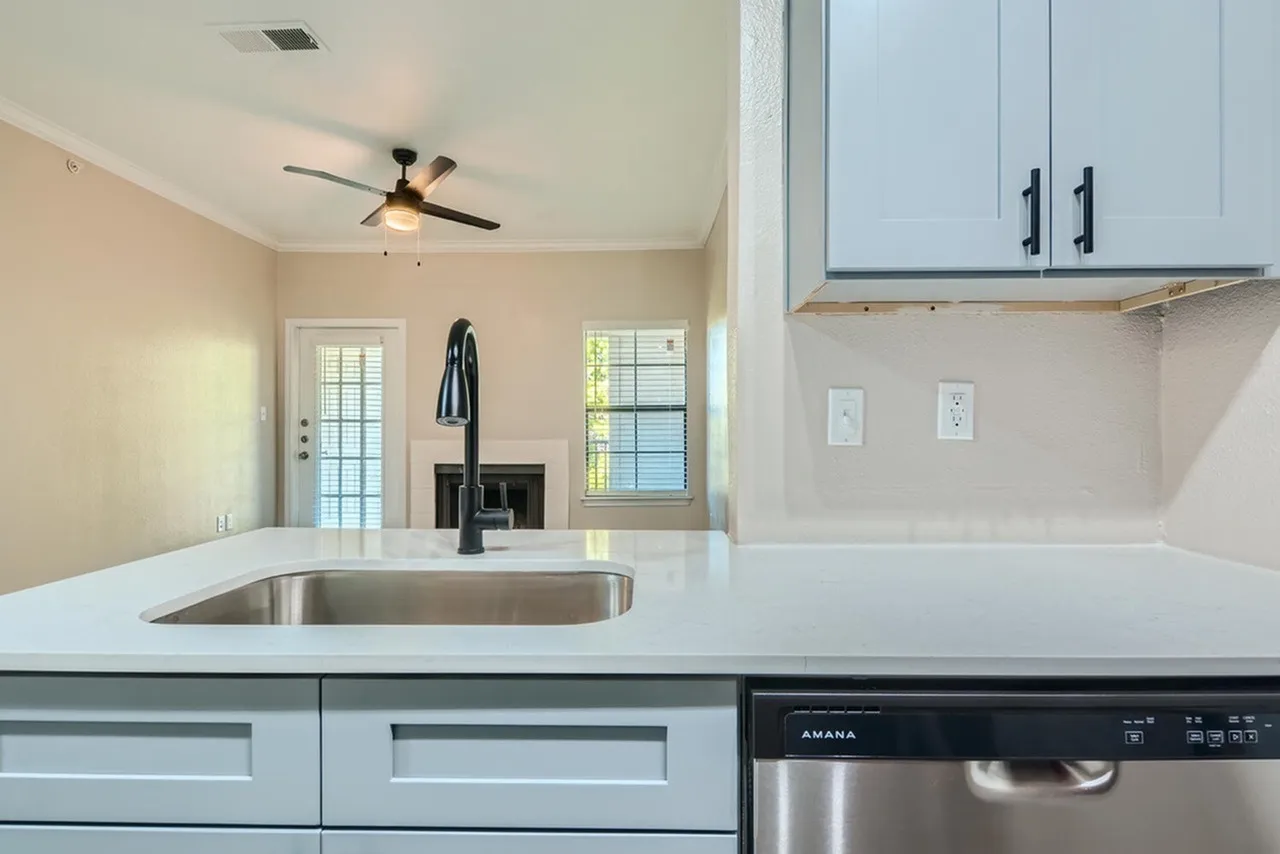 Kitchen, white shaker cabinetry, quartz countertops, stainless appliances, undermount sink