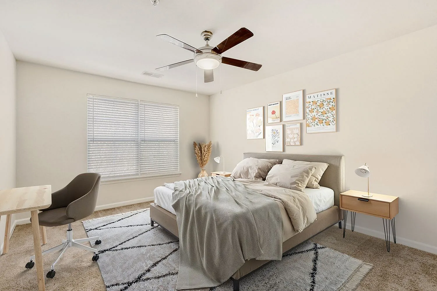 Primary bedroom, wood-style plank flooring, ceiling fan, area rug, wall art