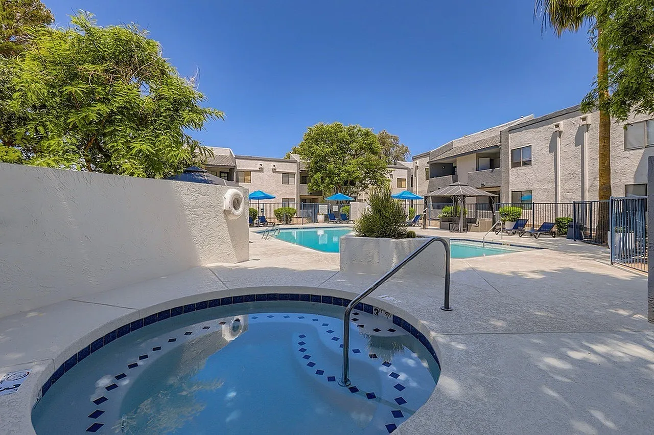 Spa, turquoise water, handrail, lounge chairs, resort-style pool, desert landscaping