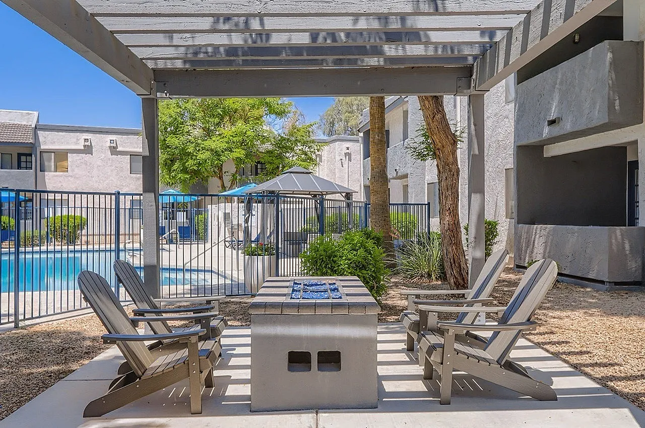 Poolside patio, pergola, Adirondack chairs, fire table, pool fence