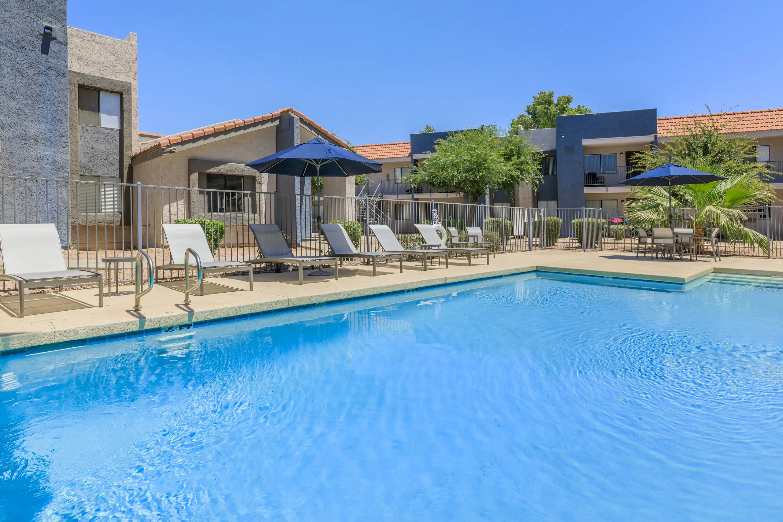 Pool deck with lounge seating and dining area