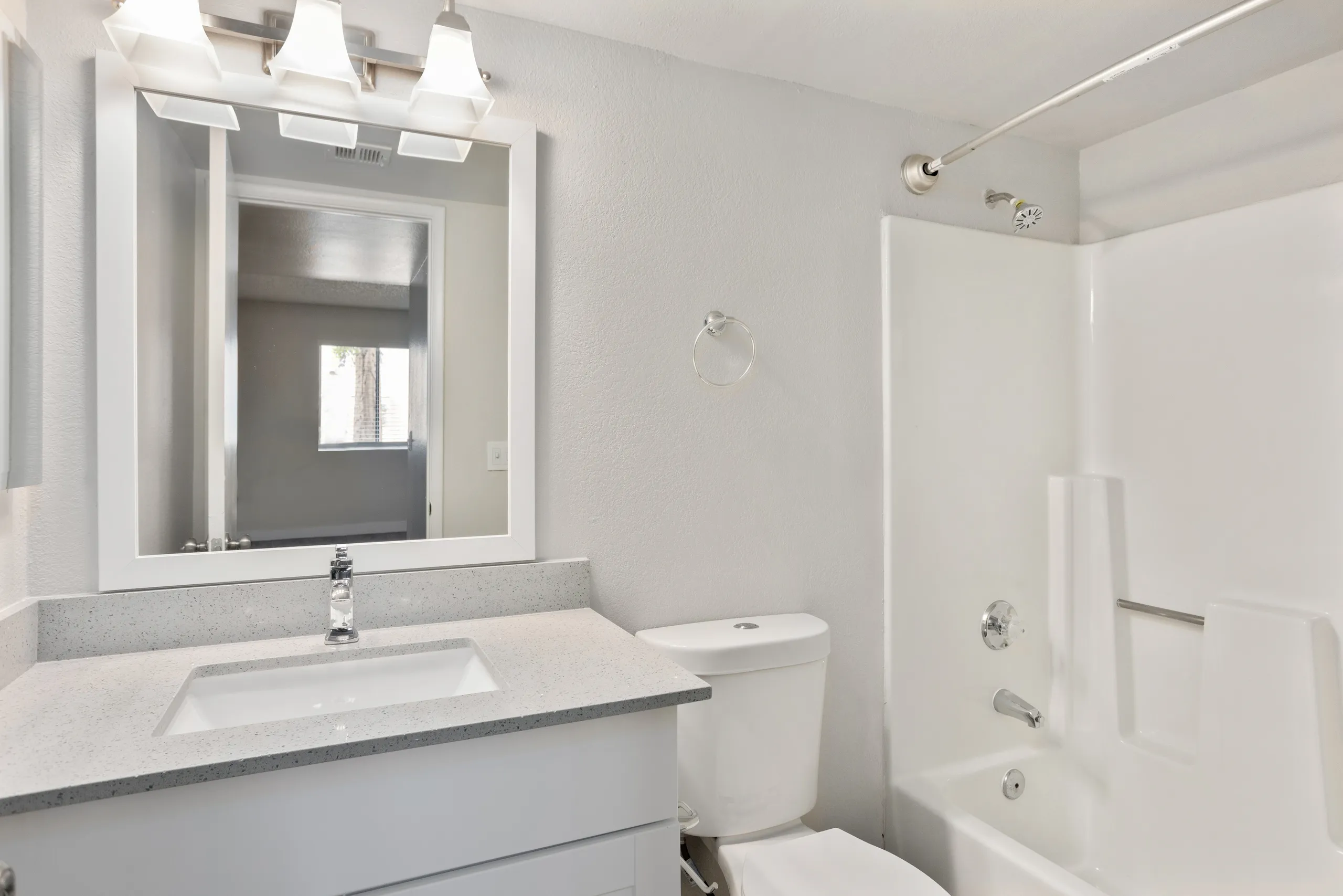 Ensuite bathroom with vanity and tub/shower combo