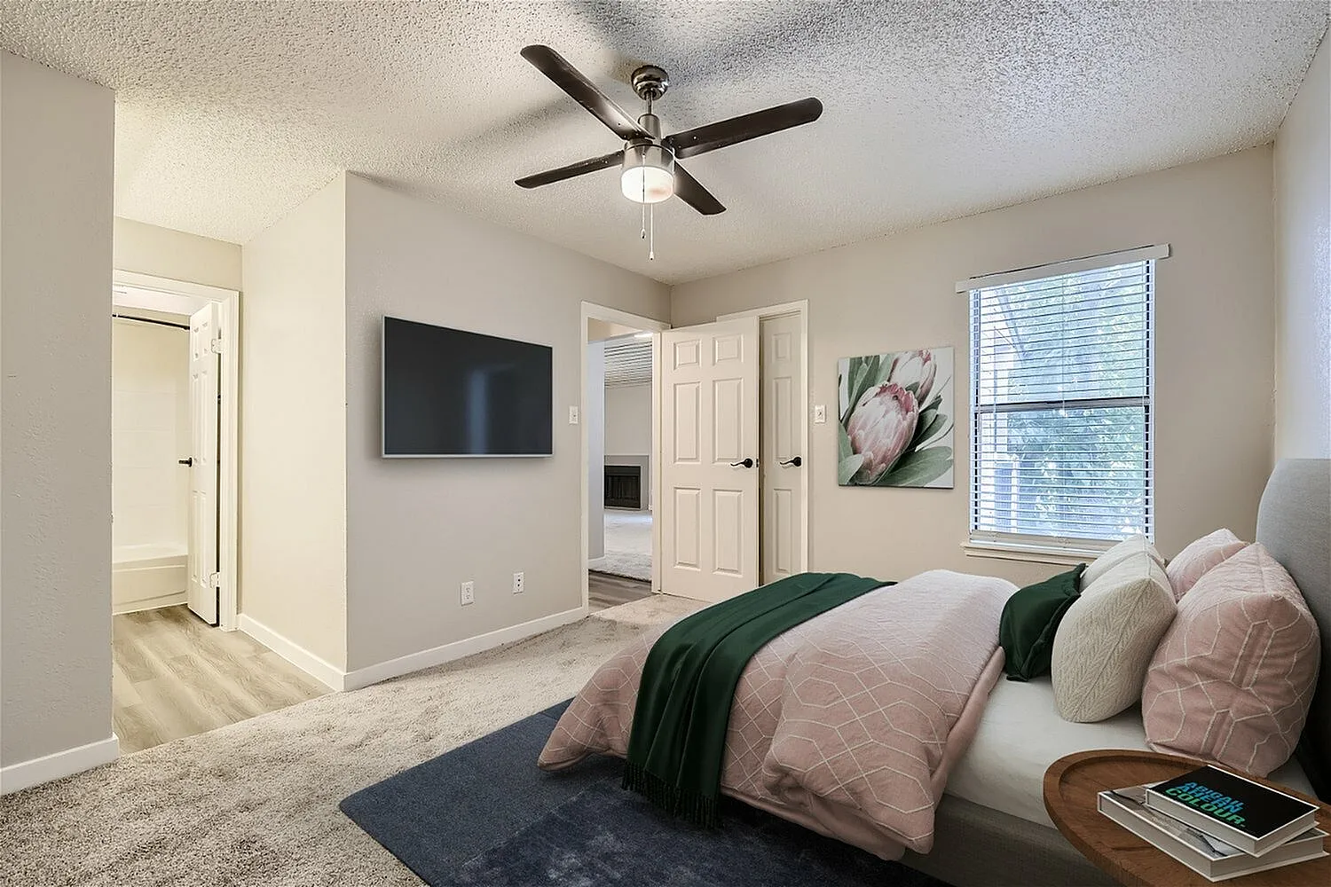 Bedroom, ceiling fan, window with blinds, carpet flooring, doorway to hall