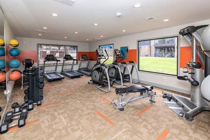 Fitness center, treadmills, ellipticals, weight bench, exterior windows