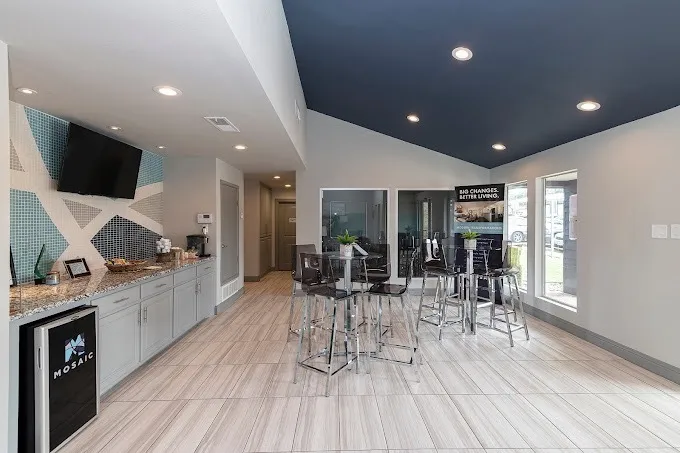 Clubhouse, coffee bar, high-top seating, vaulted ceiling, wood-style plank flooring
